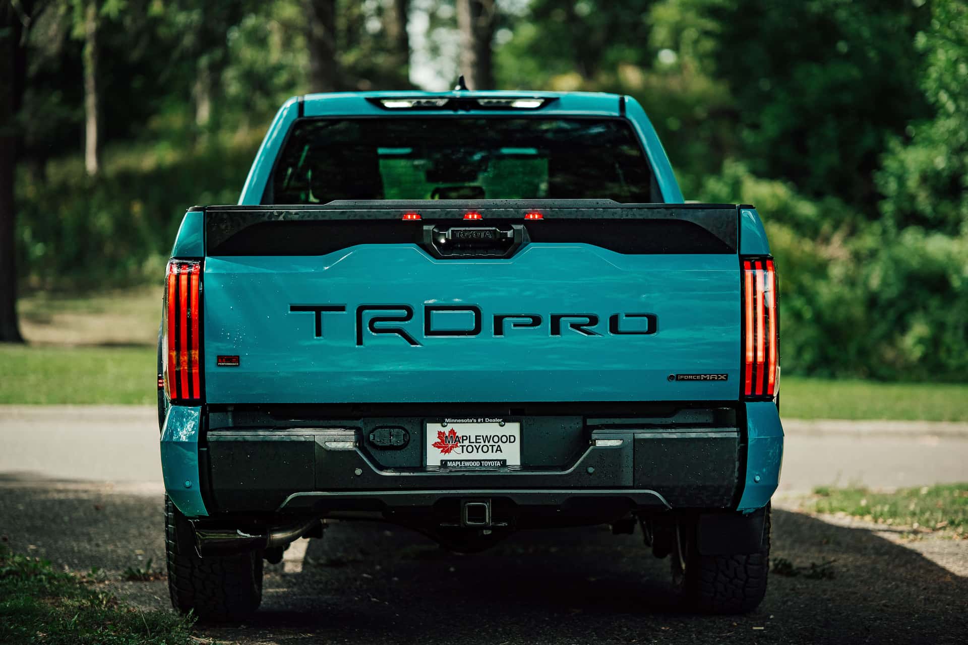 A striking blue TRD Pro truck is parked outdoors