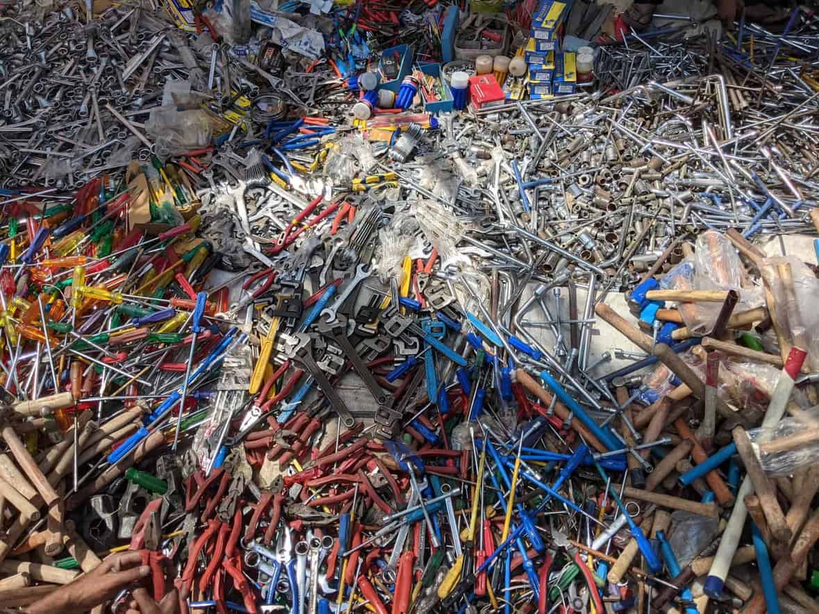 Vibrant collection of various hand tools scattered in an outdoor market in Lucknow, India