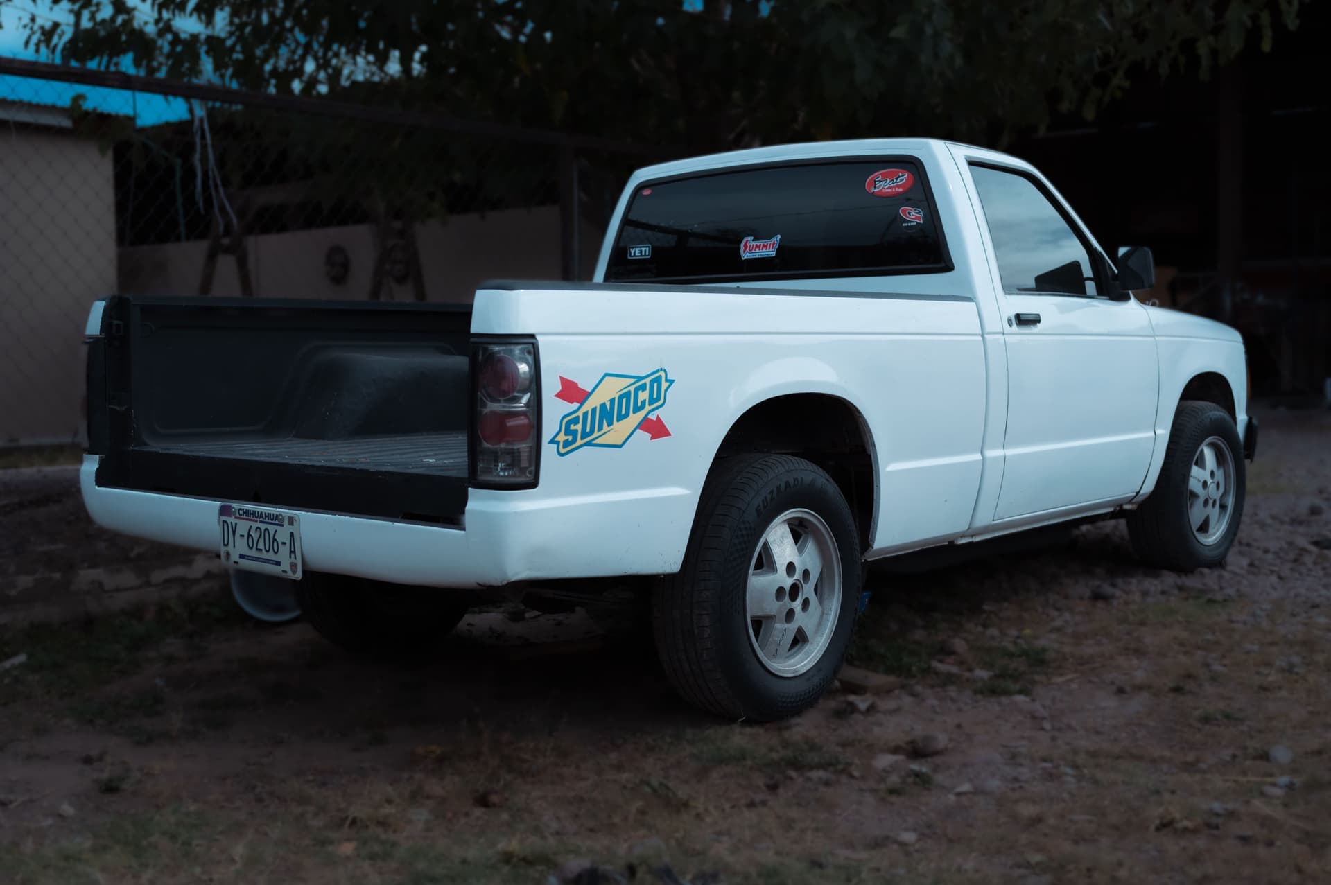 A white pickup truck with Sunoco branding parked in Nuevo Casas Grandes, Mexico